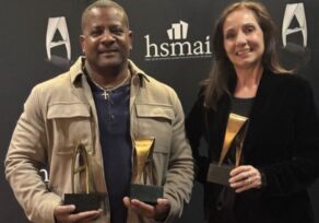 Larry Aldrich and Fran Vaccaro holding 3 HSMAI Adrian Awards at the 2025 Ceremony in NYC